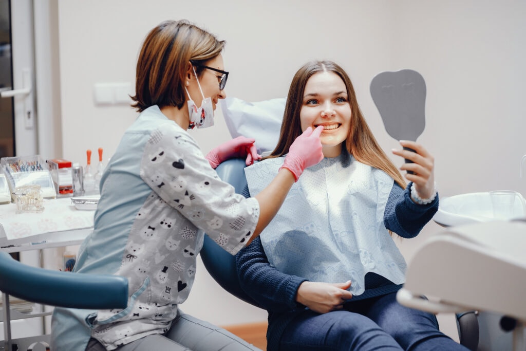 beautiful girl sitting in the dentist's office